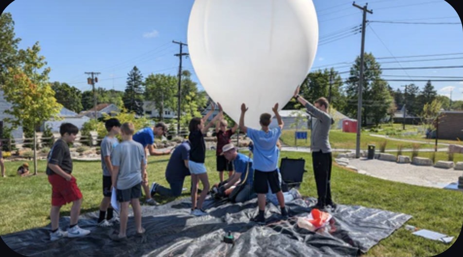 Students filling a high altitude balloon