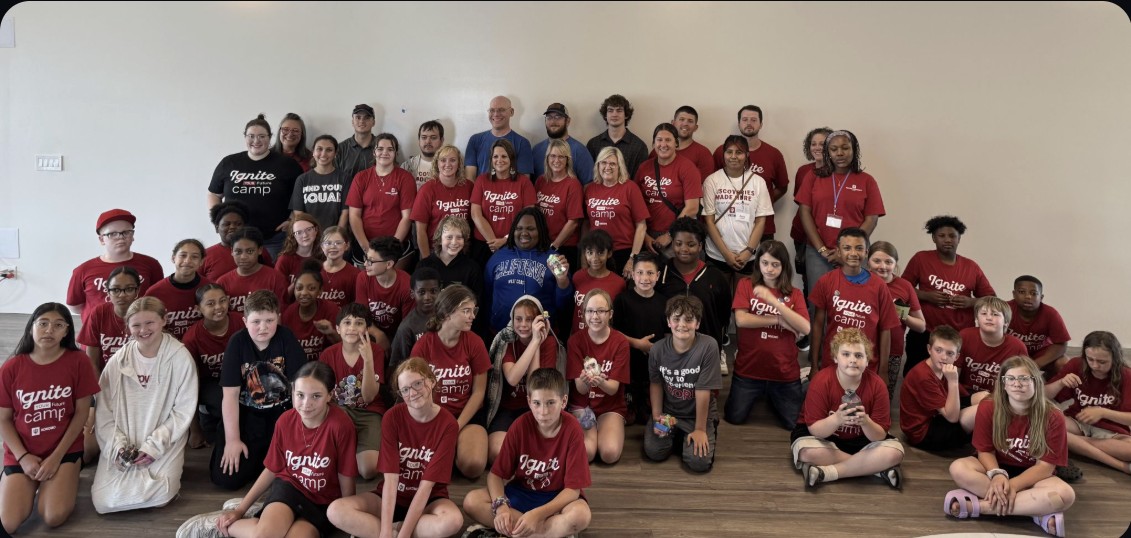 A camp group gathered in the STEM Makerspace